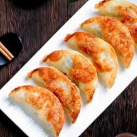 Pot Stickers (6)锅贴 · Steamed or fried.