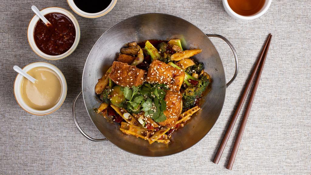 Kung Fu Hustle · Deep-fried crispy tofu is stir-fried with diced celery, broccoli, snow peas, white mushrooms, bamboo, water chestnut, and chili pepper