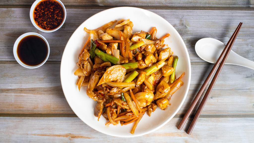 Kung Pao Monk · Chicken stir-fried with celery, broccoli, snow peas, white mushrooms, bamboo, carrots, water chestnuts, peanuts, and chili pepper.