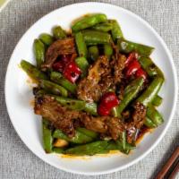 Snow Pea Temple Of Flavor · Stir-fried beef with snow peas, carrots, celery, and onions.