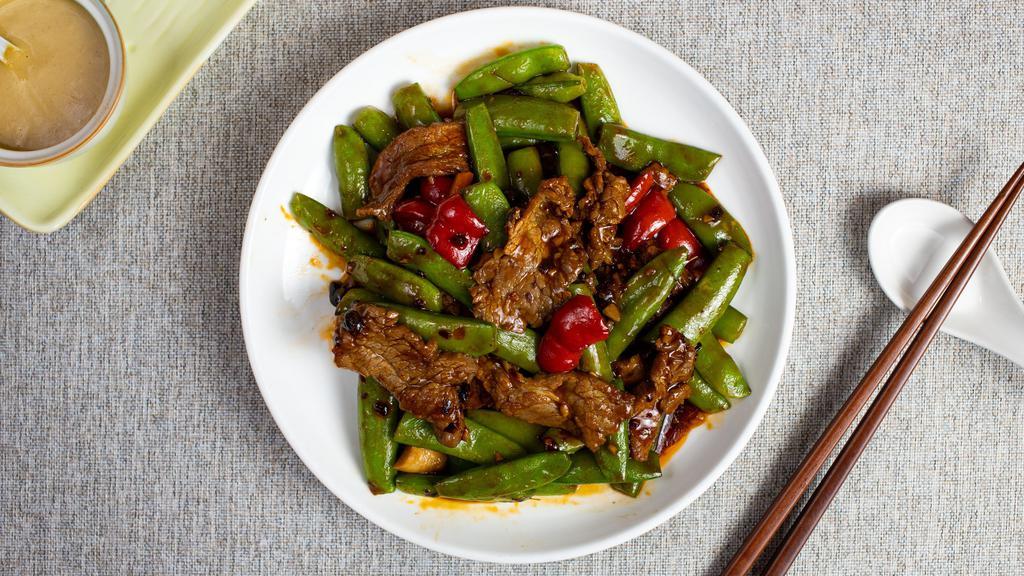 Snow Pea Temple Of Flavor · Stir-fried beef with snow peas, carrots, celery, and onions.