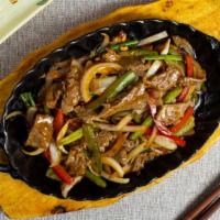 The Fusion Of The Pork · BBQ pork with broccoli, bell peppers, onions, zucchini, and carrots in a black bean sauce.