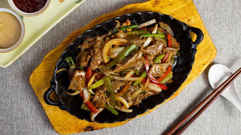 The Fusion Of The Pork · BBQ pork with broccoli, bell peppers, onions, zucchini, and carrots in a black bean sauce.