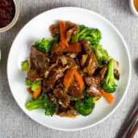 Pork At The Woods Delight · Stir-fried BBQ pork with broccoli, carrot, and onion in a house made brown sauce.