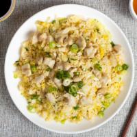 Fried Chicken Rice Ceremony · Chicken pan-fried with steamed rice, egg, peas, and green onions.