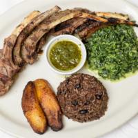 Cordero A Las Brasas · Marinated and grill rack of lamb to perfection, served with moros and cristianos, spinach, c...