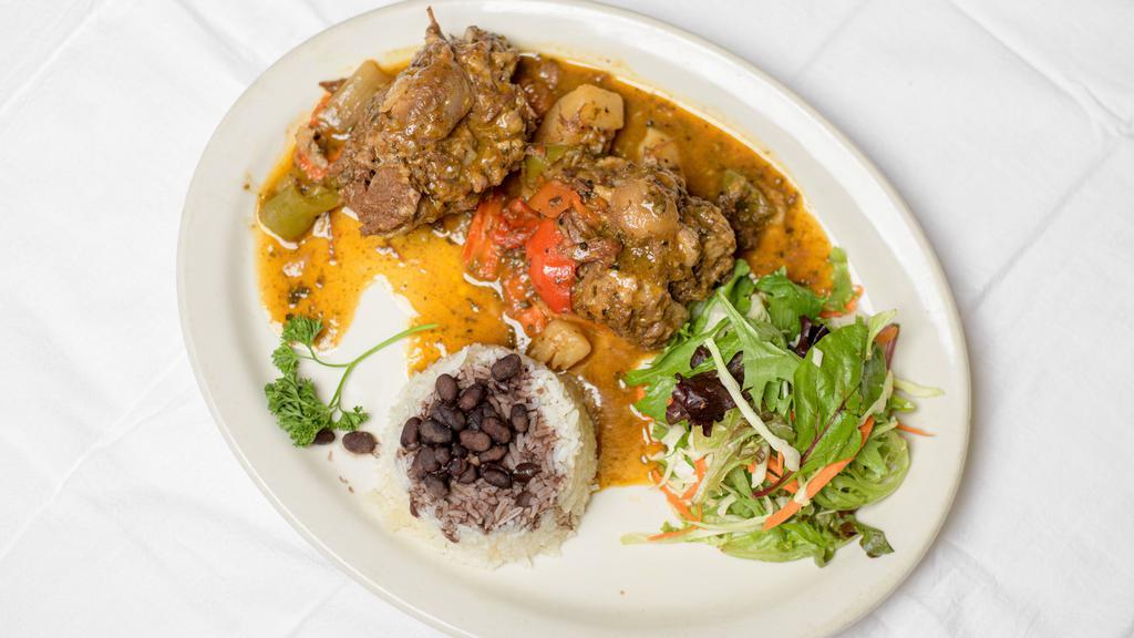Rabo Encendido · Braised oxtail, served with white rice, black beans.