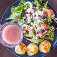 Greek Salad · Spring mix of lettuce, red onion, kalamata olives, tomato, cucumber and feta.