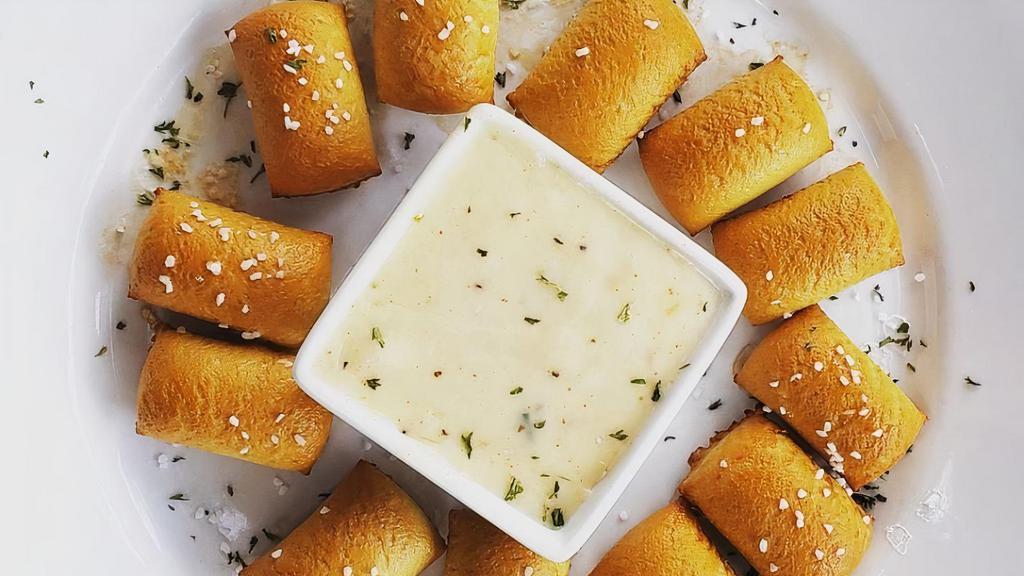 Giant Pretzel + Beer Cheese · Giant Warm pretzel  served with a creamy beer cheese dipping sauce.