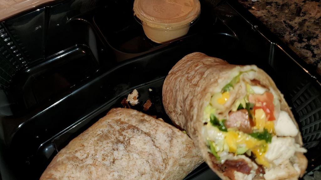 Southwest Chicken Wrap · Grilled chicken, bacon, lettuce, tomato, & sliced cheddar served in a warm wheat tortilla with chipotle mayo.