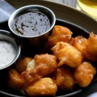 Wisconsin Cheese Curds · Beer battered cheese curds, jalapeño jelly, peppercorn sauce.. We charge 20% more for items ...