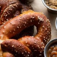 Hearth Baked Pretzel · Choose one sauce. Additional sauces for $1.5 each.. We charge 20% more for items on ALL thir...