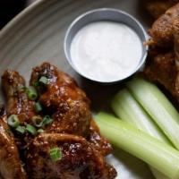 Tavern Wings 1/2 & 1/2 · One pound of Draper Valley Chicken Wings. Hot Sauce & Blue Cheese Sesame Glaze & Sriracha