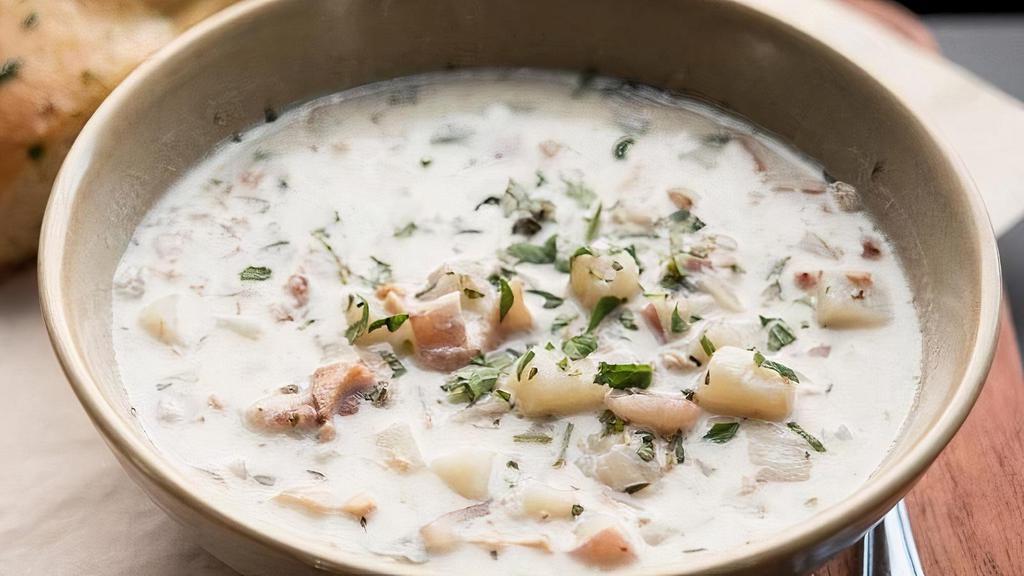 Bowl Of Clam Chowder · New England Style clam chowder, smoked bacon, red potatoes.  Bowl served with herb focaccia.