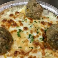 Baked Fettuccine With Meatballs · Gorgonzola cream sauce, topped with our italian meatballs, mozzarella & parmesan.