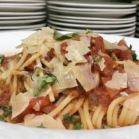 Basil Spaghetti Marinara · Homemade marinara & parmesan.