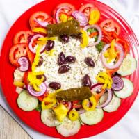 Greek Salad · Romaine lettuce, tomatoes, cucumbers, banana peppers, Kalamata olive, onion and feta cheese.