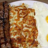 New York Steak & Eggs · 8 oz u. S. D. A. Choice steak. Cooked to your liking over an open flame.