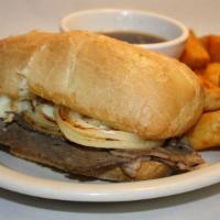 French Dip · Homemade slow cooked Angus beef served on a grilled hoagie roll with au jus.