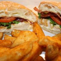 Chicken Ciabatta · Toasted homemade ciabatta with grilled chicken breast, Swiss, bacon & mayo. Lettuce, tomato ...