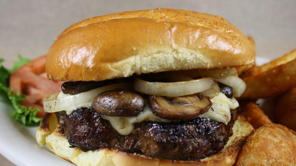 Garbage Burger · This burger served with sauteed onions and mushrooms, Swiss cheese, hardwood smoked bacon & mayo.