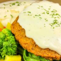 Chicken Fried Steak · Biggest fried steak in town. A fine breaded beef steak smothered in country gravy.