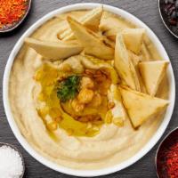 Humming Hummus Pita · Cooked and mashed chickpeas blended with tahini, lemon juice, and garlic served with pita br...