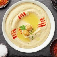 Hummusaria Fantasy · Cooked and mashed chickpeas blended with tahini, lemon juice, and garlic.