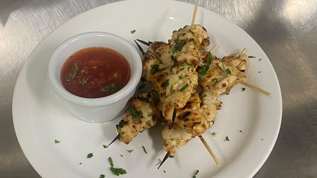Grilled Chicken Skewers · Marinated in olive oil and fresh herbs, served with sweet chili sauce