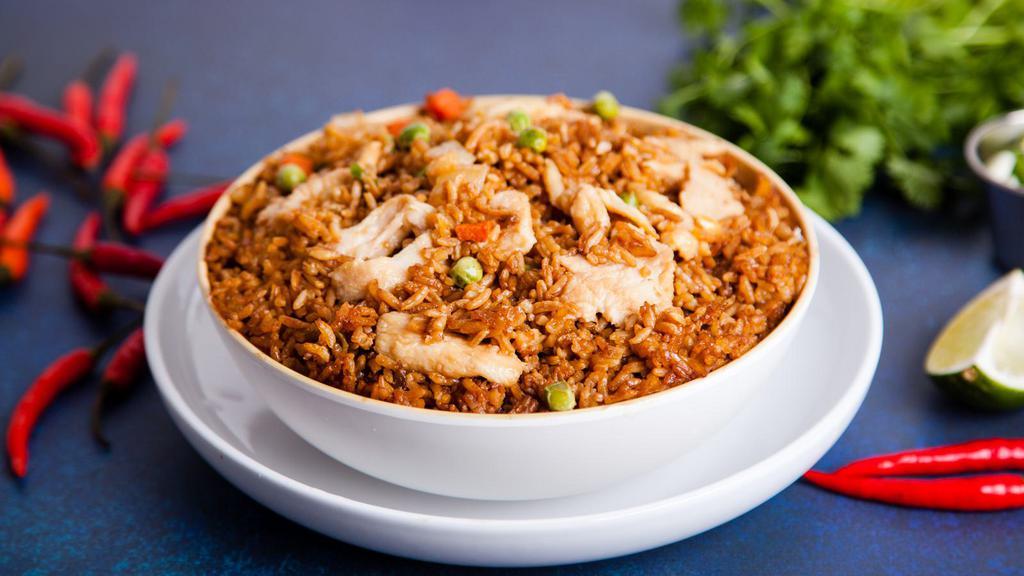 Chinese Chicken Fried Rice · Chinese fried rice with chicken, mixed vegetables, eggs, and onions.