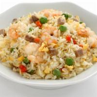 Chinese Shrimp Fried Rice · Chinese fried rice with shrimp, mixed vegetables, eggs, and onions.