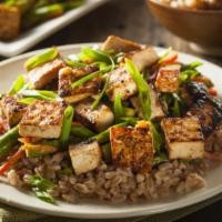 Chinese Tofu Fried Rice · Chinese fried rice with tofu, mixed vegetables, eggs, and onions.