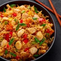 Chinese Chicken And Tofu Fried Rice · Chinese fried rice with chicken, tofu, mixed vegetables, eggs, and onions.