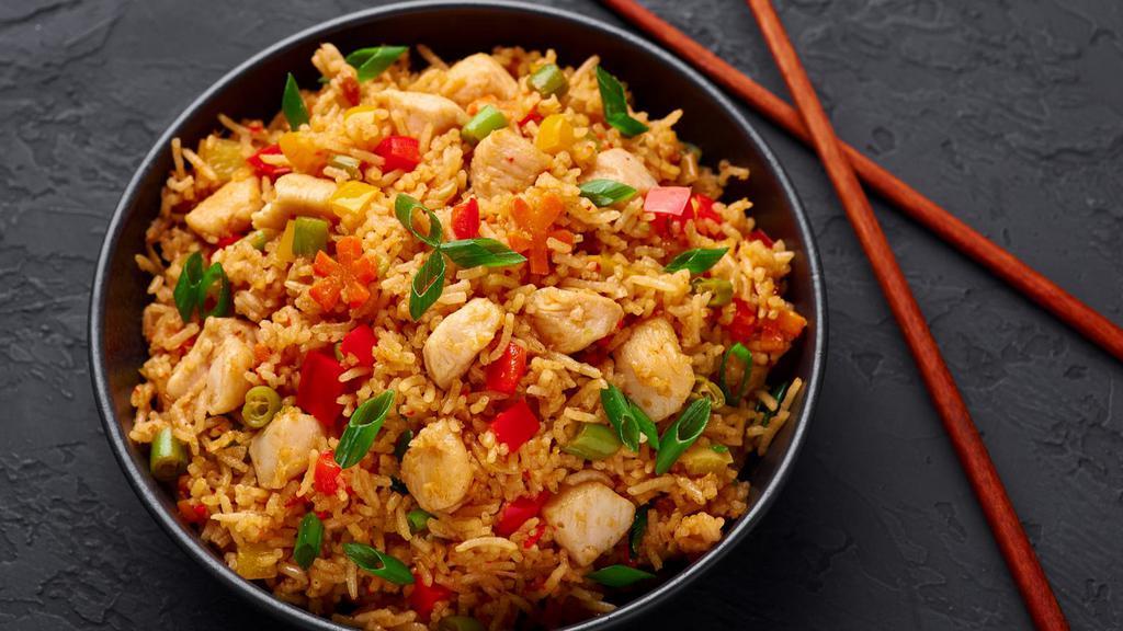 Chinese Chicken And Tofu Fried Rice · Chinese fried rice with chicken, tofu, mixed vegetables, eggs, and onions.