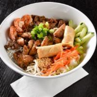Combination Noodles Salad Bowl - Bún Đặc Biệt · Shrimp and egg roll with your choice of meat. Vermicelli noodles served in a bowl with shred...