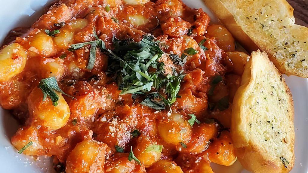 Gnocchi · Potato pasta bathed in a tomato basil cream sauce and topped with. Romano cheese