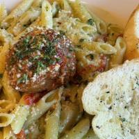 Penne Pesto Cream · Penne tossed in a basil/spinach pesto cream with roasted red peppers and. artichoke hearts