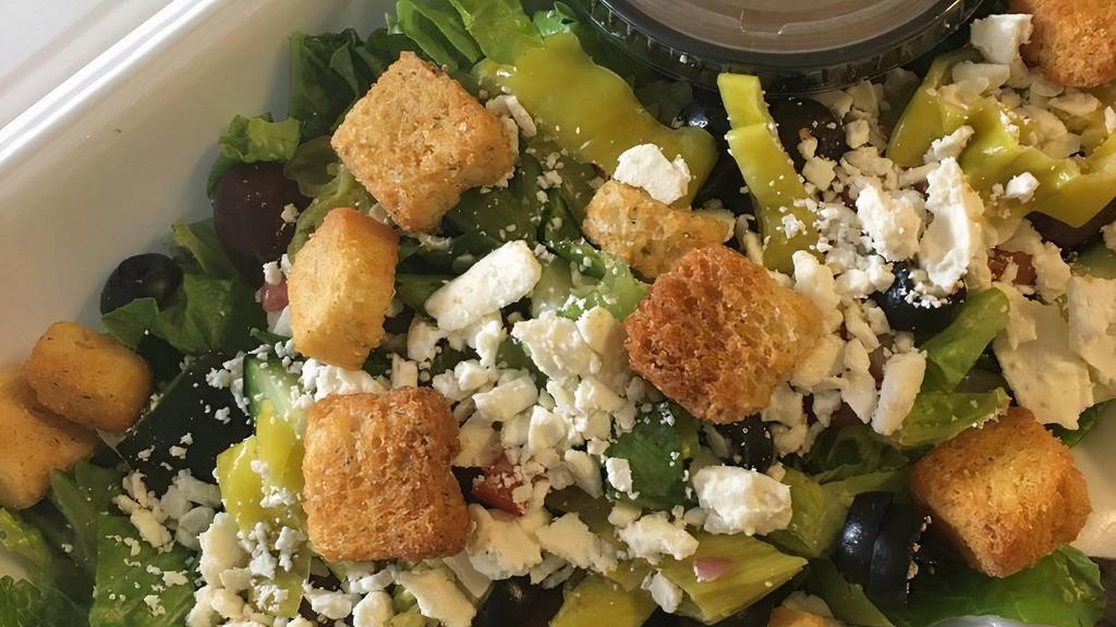 Greek Salad · Romaine lettuce, tomato, cucumbers, onion, feta cheese, kalamata olives, pepperoncini, croutons