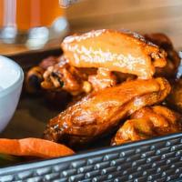 Jumbo Chicken Wings · a pound of our jumbo wings and drummettes dressed in your choice of apricot chili sambal gla...