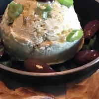 Crazy Feta · feta and roasted jalapeno dip, olive oil drizzle, green onion, kalamata olives and crispy pi...