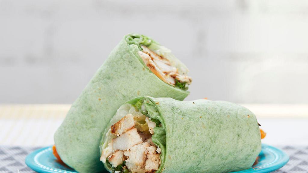 Chicken Caesar Wrap · Chicken breast, power blend of romaine, spinach and baby kale, zero carb Caesar dressing and parmesan cheese in a spinach wrap.