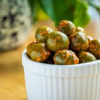 Marinated Olives · Castleveltrano Olives marinated with Aleppo Chili and Fennel Seed. Olives Still Have Their P...