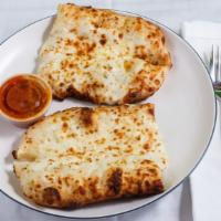 Cheese Bread · cheese bread is served with marinara sauce, mozzarella, Parmesan.