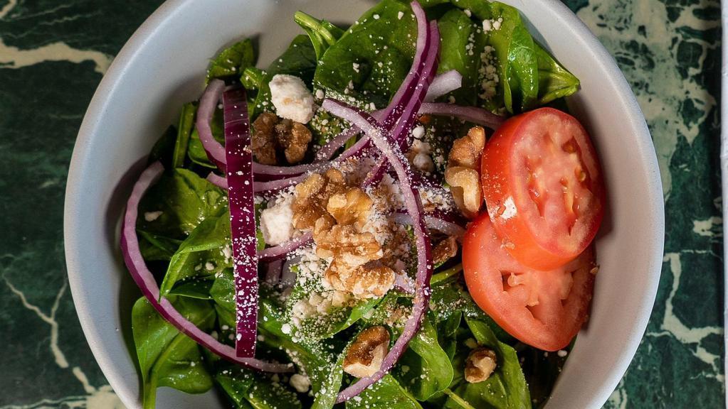 Spinach Salad - Whole · Spinach salad is served with goat cheese, honey raspberry vinaigrette, red onions, spinach, tomatoes, walnuts.