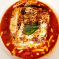 Lasagna · Lasagna is served with marinara sauce, mozzarella, Parmesan.