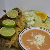 Mojarra Frita · Fried fish with rice, beans and salad.