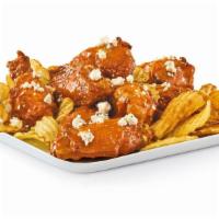Chicken Wings · Crispy bone-In wings tossed in your choice of sauce and served on a bed of kettle chips.