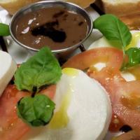 Caprese Salad · Fresh mozzarella,tomato,basil,balsamic glaze & slice of bread