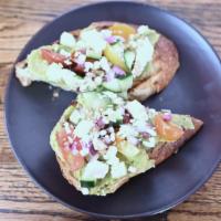 Avocado Toast · Sourdough toast with seasoned avocado spread, cucumber, heirloom tomatoes, red onion, feta c...