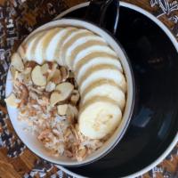 Coasting Oatmeal · Creamy oats with spices, topped with coconut, almonds and dried fruit.